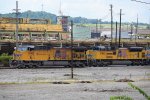 UP Engines Lead a SB CSX Train as NSs Main Tower Looks On